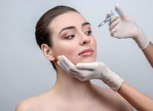 woman to be injected for non-surgical beauty procedure