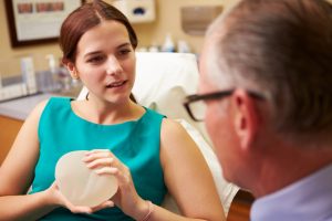 woman consulting a surgeon for breast augmentation surgery