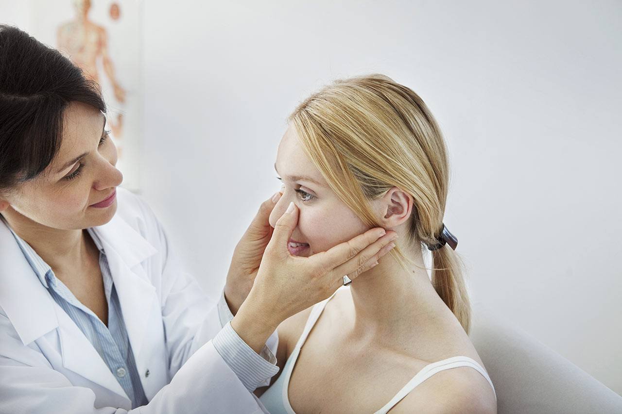 woman being examined before plastic surgery