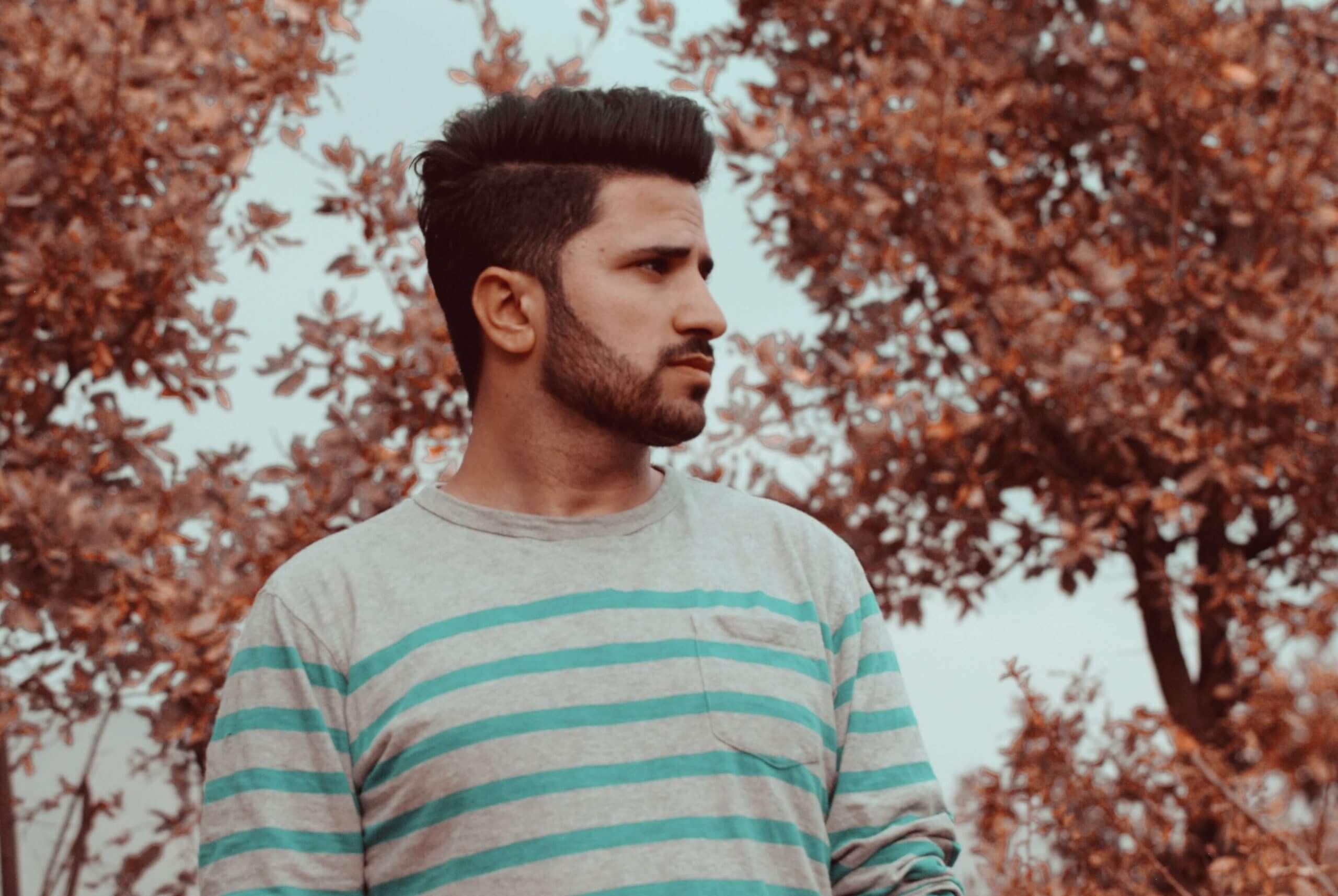 Profile of man with short beard and cropped hair