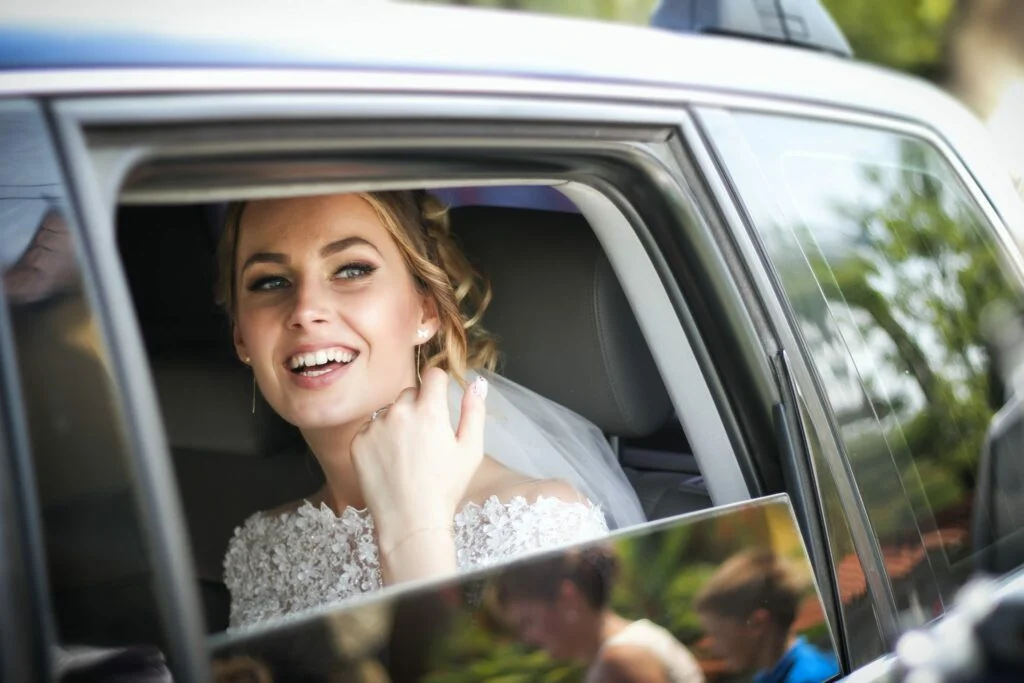 smiling bride in a limo