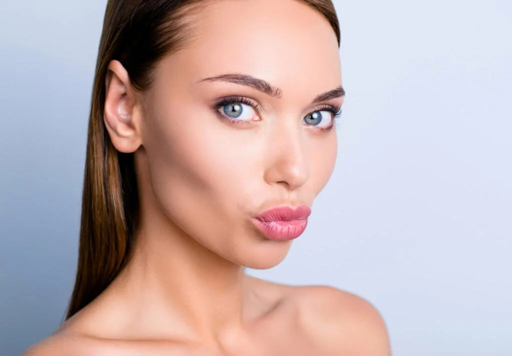 woman kissy lips face