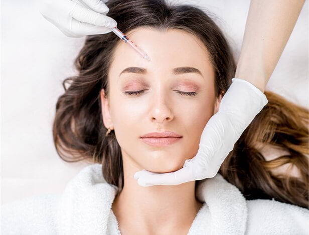 Woman receiving a botox injection