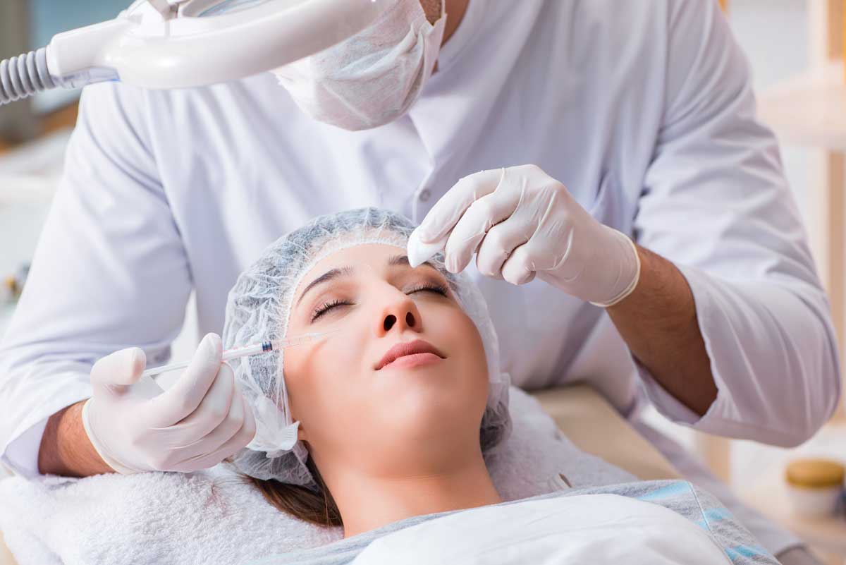 a woman receiving Botox injections