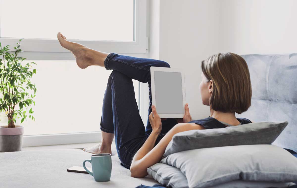 Woman resting with tablet