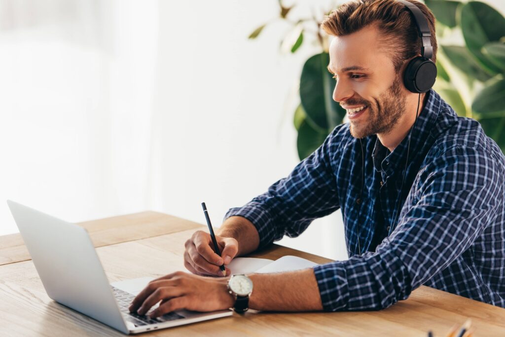 Man listening to music who has benefitted from a hair transplant expert