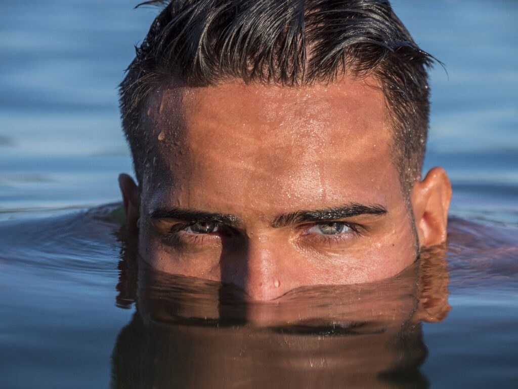 Man in the water who knows the hair transplant success rate